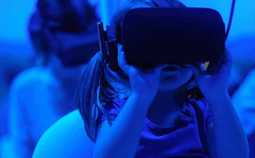 A girl using a VR headset.